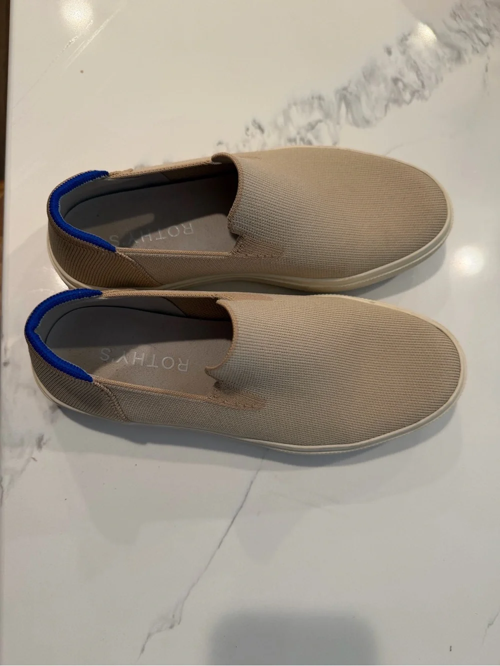 Rothy's Slip-On Flats in Tan with Blue Heel Accent